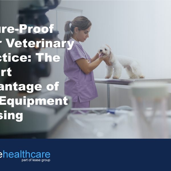 Image of veterinary examination room and a nurse in pink scrubs stroking a small white dog to demonstrate the benefits of vert equipment leasing