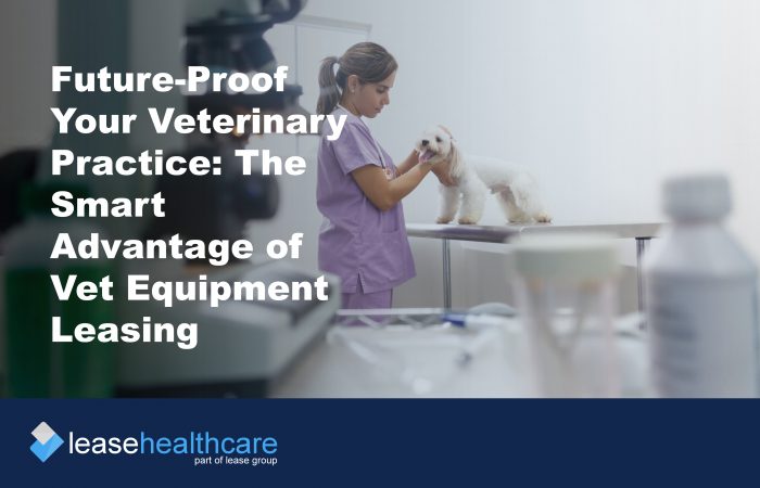 Image of veterinary examination room and a nurse in pink scrubs stroking a small white dog to demonstrate the benefits of vert equipment leasing